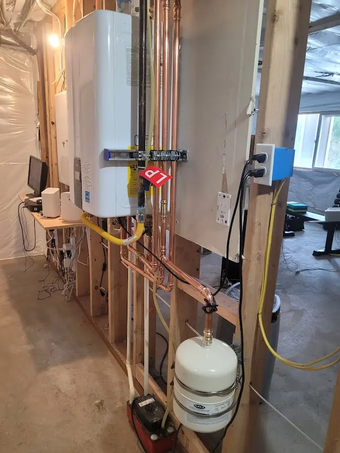 Licensed plumber repairing a kitchen sink in Porter