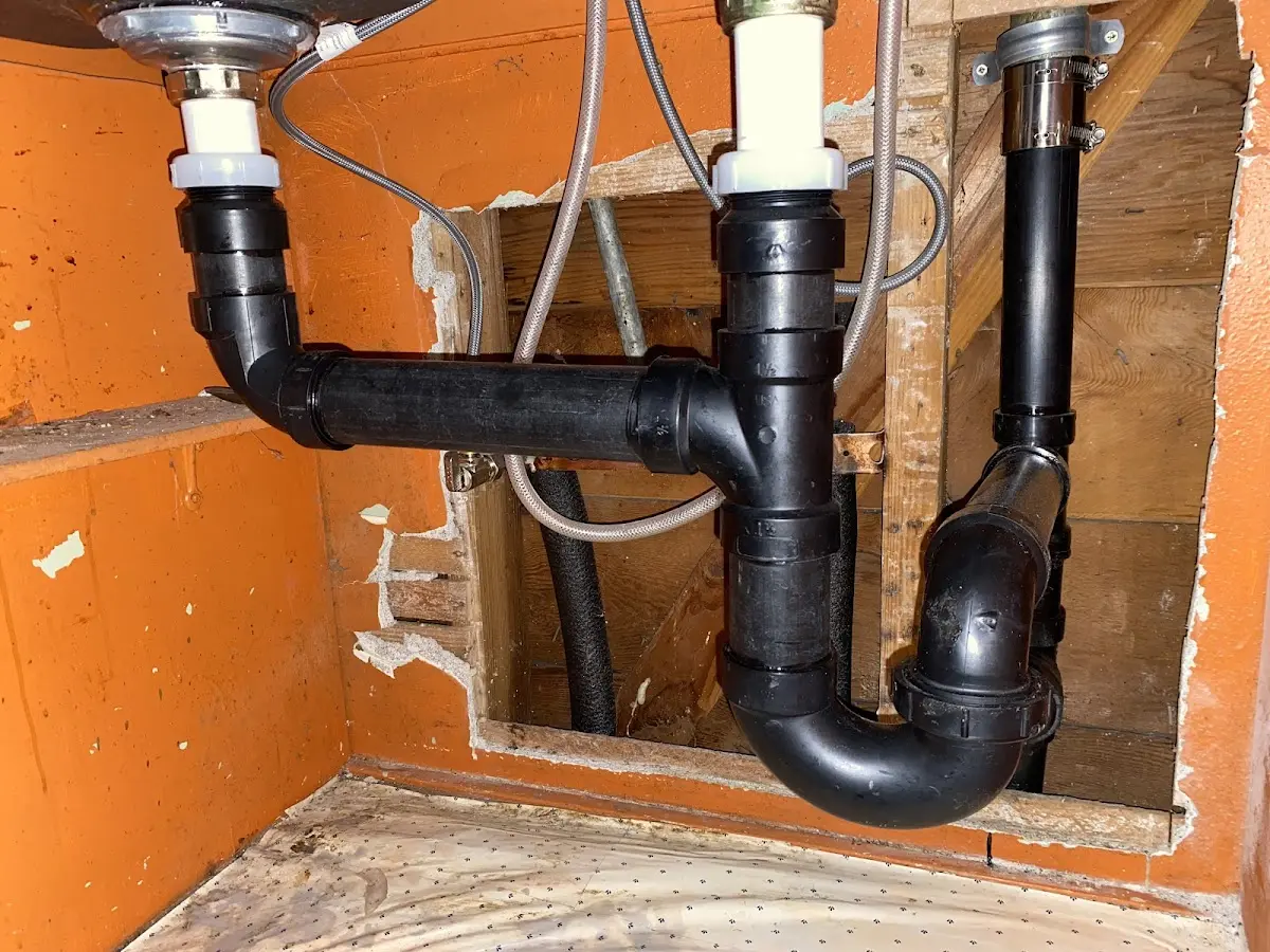Professional Garbage Disposal Repair equipment and tools on the job in Porter